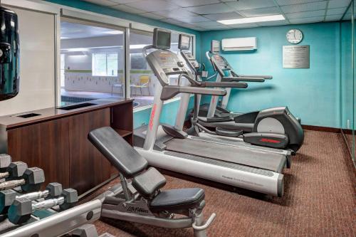 a gym with several cardio machines in a room at Fairfield Inn Tuscaloosa in Tuscaloosa