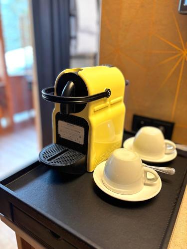 a yellow toaster sitting on top of a table at Boutique-Pension Jägerwirt in Scheffau am Wilden Kaiser