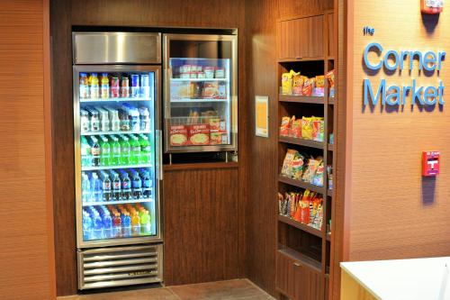 a refrigerator filled with lots of drinks in a store at Fairfield Inn & Suites by Marriott Omaha Northwest in Omaha