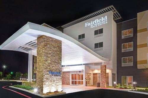 a hotel building with an archway in front of it at Fairfield Inn & Suites by Marriott Houston NASA/Webster in Webster