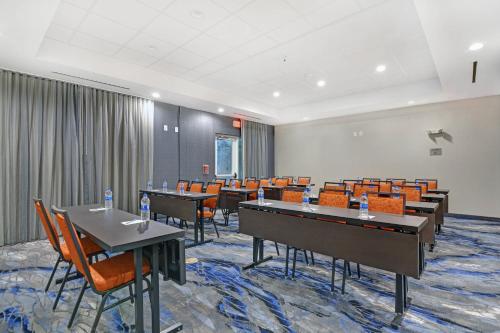 a conference room with tables and chairs and a pool table at Fairfield Inn & Suites by Marriott Houston NASA/Webster in Webster