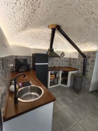 a kitchen with a sink and a counter top at La Madriguera Eco Caves in Guadix