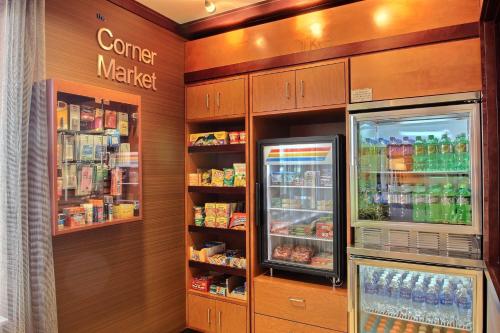 a store with a refrigerator and shelves with drinks at Fairfield Inn & Suites by Marriott Milwaukee Airport in Oak Creek
