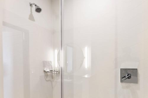 a shower with a glass door in a bathroom at Fairfield Inn & Suites by Marriott Menifee in Menifee