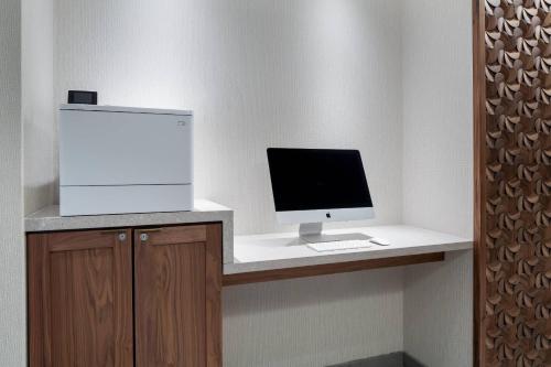 a computer on a desk with a monitor and keyboard at Fairfield Inn & Suites by Marriott Kenosha Pleasant Prairie in Pleasant Prairie