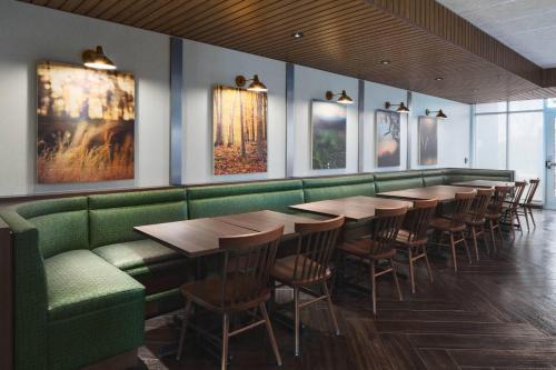a row of tables and chairs in a restaurant at Fairfield Inn & Suites by Marriott Kenosha Pleasant Prairie in Pleasant Prairie
