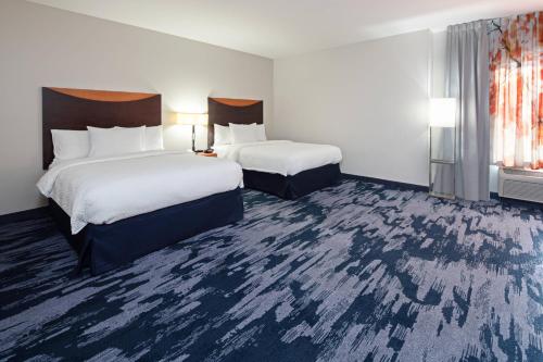 a hotel room with two beds and a window at Fairfield Inn & Suites Seattle Bremerton in Bremerton