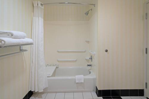 a white bathroom with a tub and a shower at Fairfield Inn & Suites Seattle Bremerton in Bremerton