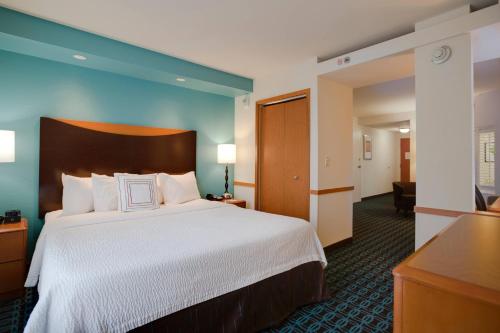 a hotel room with a bed and a desk at Fairfield Inn and Suites by Marriott Titusville Kennedy Space Center in Titusville