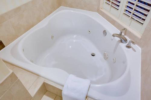 a white bath tub in a bathroom at Fairfield Inn and Suites by Marriott Titusville Kennedy Space Center in Titusville