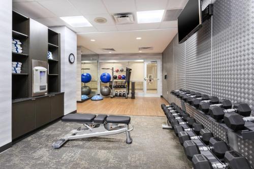 a gym with a row of chairs and weights at Fairfield Inn & Suites by Marriott Goshen in Goshen