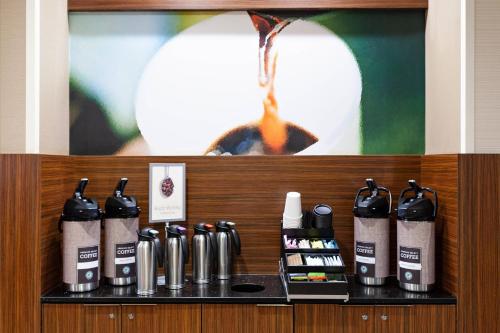 a shelf with several bottles of hair products on it at Fairfield Inn & Suites by Marriott - Rockingham, NC in Rockingham