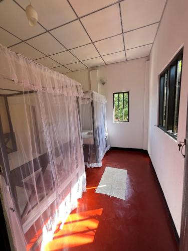 Postel nebo postele na pokoji v ubytování Dili's Homestay