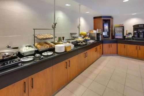 a kitchen with a counter with food on it at Fairfield Inn & Suites by Marriott San Francisco Airport in Millbrae