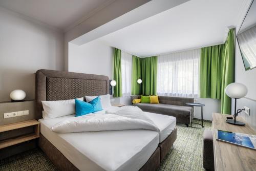 a hotel room with a bed and a couch at Alpenaussicht in Obergurgl