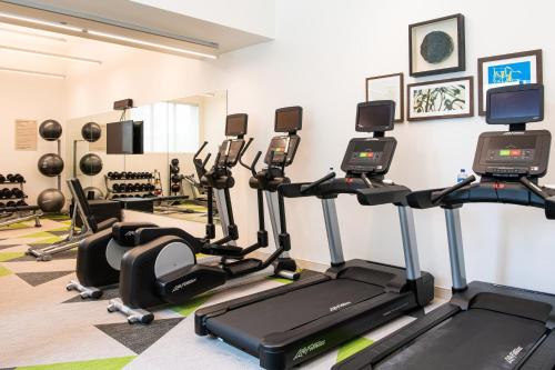 a gym with treadmills and elliptical machines at Element Scottsdale at SkySong in Scottsdale