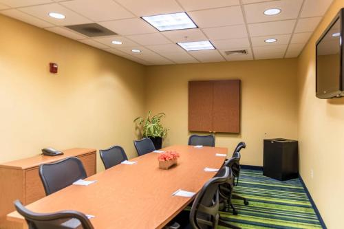a conference room with a long table and chairs at Fairfield Inn & Suites by Marriott Muskegon Norton Shores in Norton Shores