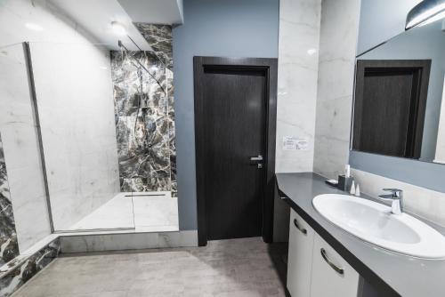 a bathroom with a sink and a shower at Синя гора in Bukovel