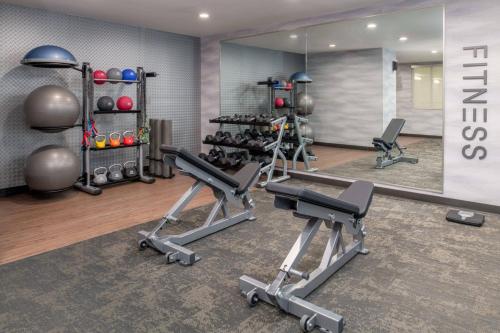 a gym with two tread machines and a mirror at Fairfield Inn Spokane Downtown in Spokane
