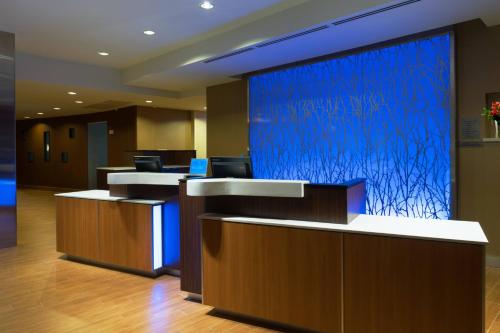 a lobby with a large blue screen in a building at Fairfield Inn & Suites by Marriott Fort Stockton in Fort Stockton