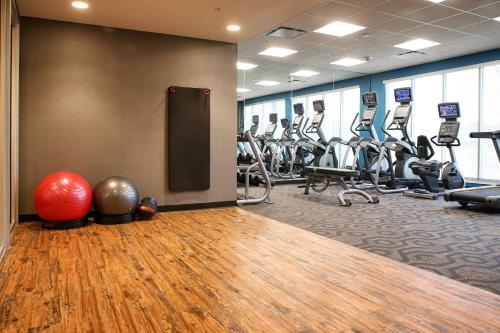 a gym with a bunch of treadmills and exercise equipment at Fairfield Inn & Suites by Marriott Madison Verona in Verona