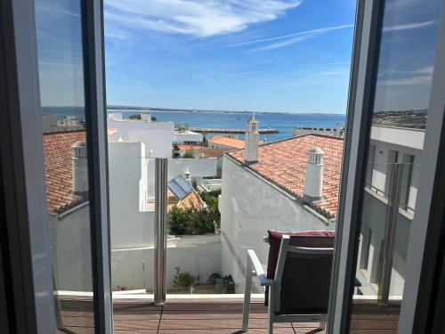 a view of the ocean from a balcony at Casa Paula Apartments in Lagos