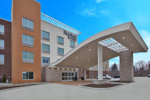 a hospital building with a large building with a building at Fairfield Inn & Suites by Marriott Flint Grand Blanc in Grand Blanc