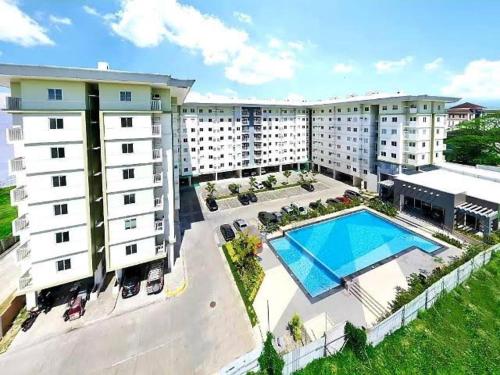 an overhead view of a hotel with a swimming pool at 2 Bedroom Condo Unit with Balcony Amaia Steps Altaraza in Tunkong Manga
