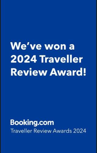 a blue sign that says weve won a traveler review award at Urban Residence Apartments in Mostar