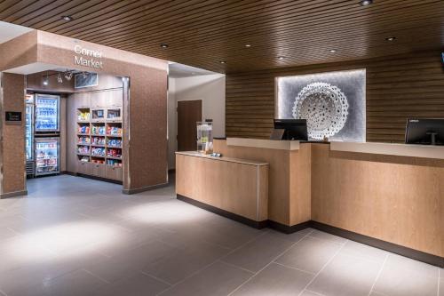 a lobby of a store with a counter and a cash register at Fairfield Inn & Suites by Marriott Staunton in Staunton