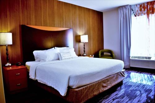 a hotel room with a large bed and a window at Fairfield Inn and Suites by Marriott Strasburg Shenandoah Valley in Strasburg