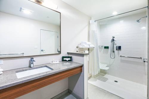 a bathroom with a sink and a shower at Fairfield Inn & Suites by Marriott Tulsa Catoosa in Catoosa