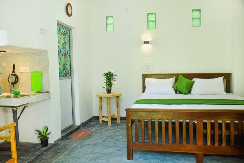 a bedroom with a bed and a desk in a room at Villa Nature Hide in Unawatuna