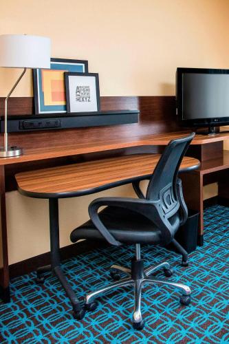 a desk with a chair in a hotel room at Fairfield Inn & Suites South Bend Mishawaka in South Bend