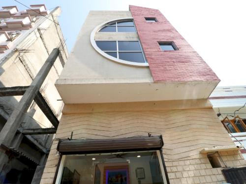 a building with a round window on top of it at Hotel O Mall Residency in Amritsar