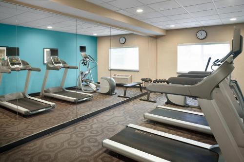 a gym with cardio equipment and a mirror at Fairfield Inn & Suites Minneapolis Bloomington/Mall of America in Bloomington