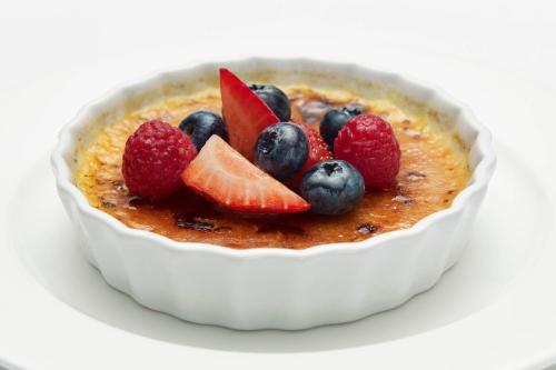 a white bowl of food with fruit in it at Delta Hotels by Marriott Toronto Mississauga in Mississauga