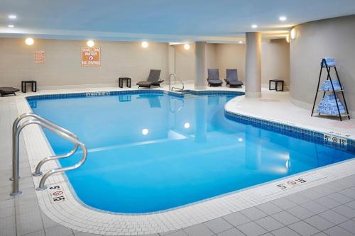 a large swimming pool in a hotel room at Delta Hotels by Marriott Toronto Mississauga in Mississauga