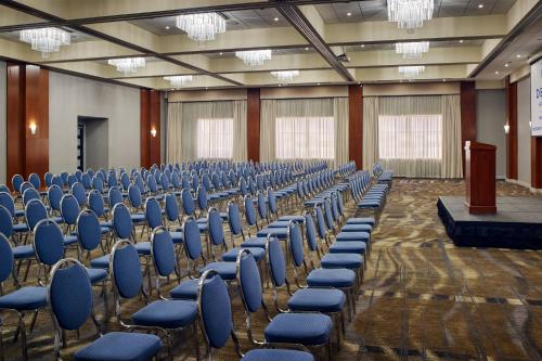 a large room with chairs and a podium in it at Delta Hotels by Marriott Toronto Mississauga in Mississauga