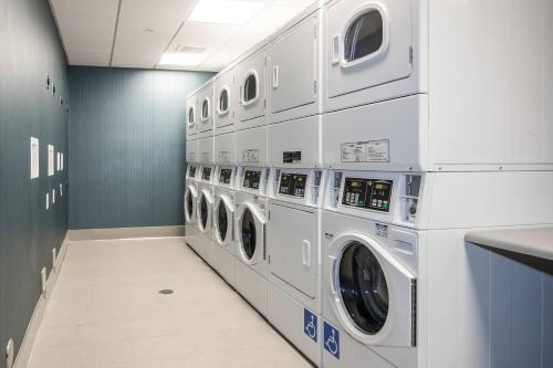 a laundry room with multiple washers and dryers at Fairfield Inn & Suites by Marriott San Jose North/Silicon Valley in San Jose