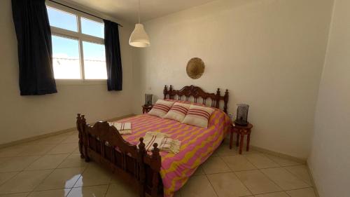 Postel nebo postele na pokoji v ubytování Tamraght surf appartement