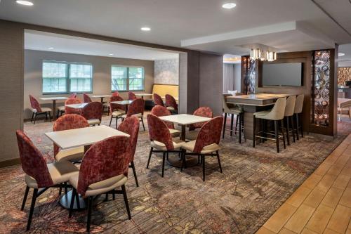 a restaurant with tables and chairs in a room at Fairfield Inn & Suites by Marriott Great Barrington Lenox/Berkshires in Great Barrington