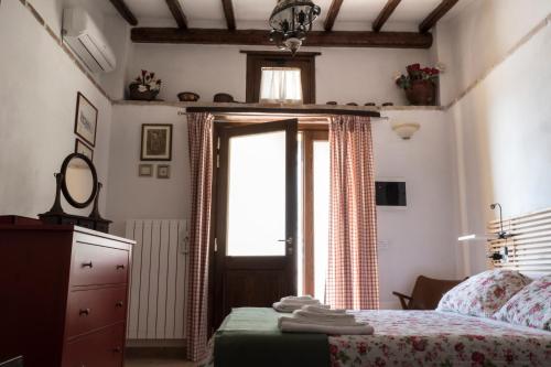a bedroom with a bed and a window at B&B Cantico Delle Creature in Assisi