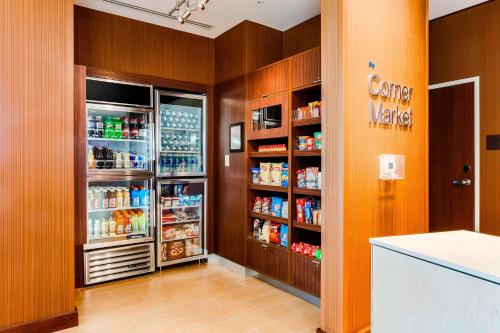 a kitchen with an open refrigerator with food at Fairfield Inn & Suites by Marriott Pecos in Pecos