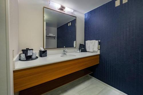 a bathroom with a sink and a mirror at Fairfield Inn by Marriott Hazleton in Hazleton