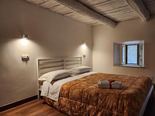 a bedroom with a large bed and a window at Al Duomo "via Mazzocchi" in Santa Maria Capua Vetere