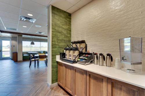 an office lobby with a counter with a coffee maker at Fairfield Inn & Suites Warsaw in Warsaw