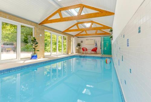a swimming pool in a house with a pool at The Condo Swimming Pool available from May until October only in Broadmayne