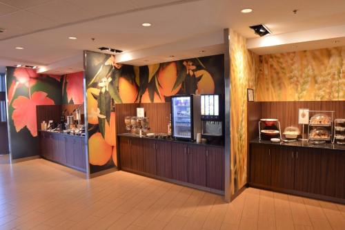 a restaurant with a display case in a room at Fairfield Inn & Suites by Marriott Dunn I-95 in Dunn