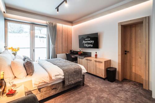 Postel nebo postele na pokoji v ubytování Wellness Apartmány Viktória